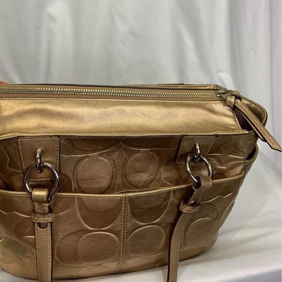 COACH gold handbag. Purple lining. Embedded coach logo. Big outside pock… - Picture 7 of 10
